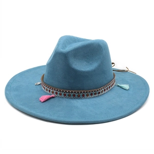 Detailed view of sea blue wide-brimmed felt hat with bohemian patterned leather band