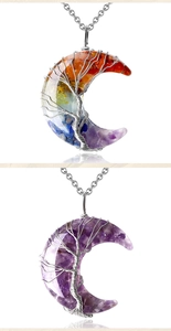 Macro detail of crescent moon pendant with tree of life wire wrap and colorful gemstones