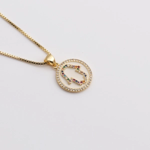 Gold-plated necklace featuring a round Hamsa hand pendant with colorful zircon stones