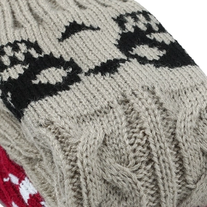 Knitted skull pattern beige gloves made of soft acrylic wool with detailed texture