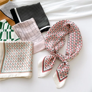 Assorted 70cm square silk scarves with elegant geometric patterns and colorful prints