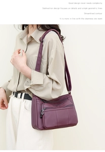 Side view of woman wearing a purple vintage soft leather crossbody bag with multi-zippers