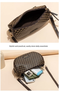 Interior view of the saddle bag showing daily essentials like phone and wallet storage