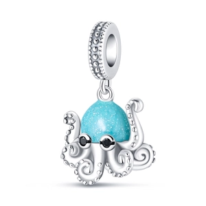 Detailed view of silver octopus charm with blue glitter head and black stone eyes
