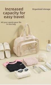 Detail of beige travel wash bag showing transparent wet dry separation compartment
