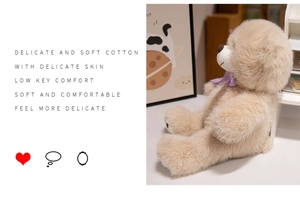 Close-up of soft fluffy brown teddy bear with lilac bowtie and delicate cotton texture