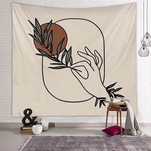 Artistic tapestry on white brick wall with botanical line art and minimalist decor