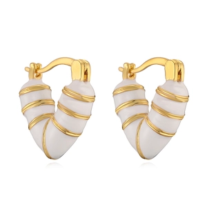 Golden heart hoop earrings with white enamel coating and elegant spiral texture