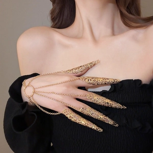Exotic hollow gold flower finger armor bracelet set with delicate metal filigree detail