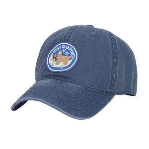 Vintage washed blue denim baseball cap featuring an embroidered bear on moon patch