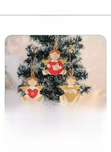 Detailed view of three wooden angel ornaments with red hearts and golden crown details