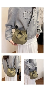 Detail view of military green nylon bucket bag with drawstring closure and shoulder strap