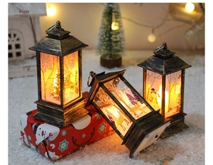 Retro Christmas LED lantern with warm glowing reindeer and snowman pattern detailing