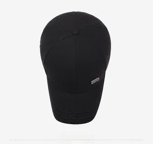 Close-up of black baseball cap featuring FISHION embroidery and SPORT metal plate detail