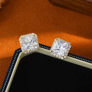 Elegant gold square halo stud earrings with clear zircon on a navy velvet jewelry box