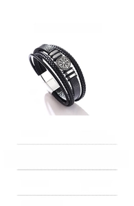 Detail showing multi-layer braided leather bracelet with Viking compass metal charm