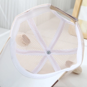 Detail view of the breathable mesh structure and interior sweatband of the kids' sun hat