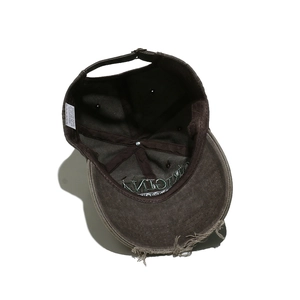 Detail view of the 100% cotton washed baseball cap showing embroidery and metal buckle