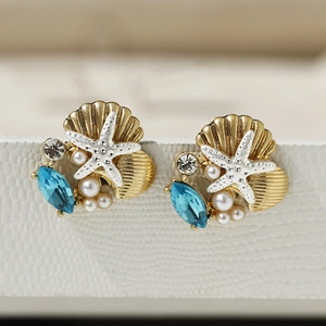 Elegant gold starfish and shell stud earrings with blue gemstone and pearls for women