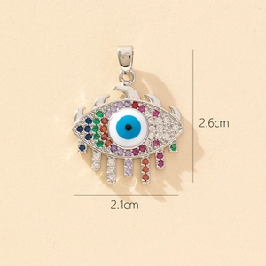 Detailed size view of silver evil eye pendant with multi-colored crystals, 2.6cm by 2.1cm