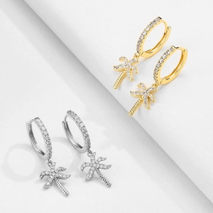 Sparkling palm tree huggie hoop earrings with pave cubic zirconia in gold and silver