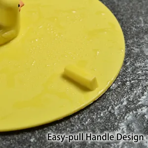 Yellow silicone duck floor drain cover with easy-pull handle and waterproof surface