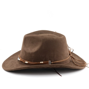 Detail of brown suede cowboy hat featuring woven cord decoration and side tassels
