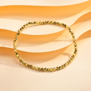 Detail of gold faceted hematite beads on a minimalist stackable bracelet for women