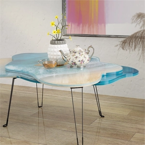 Runder Ocean River Couchtisch mit blauem Harz-Strandeffekt und schwarzen Metallbeinen