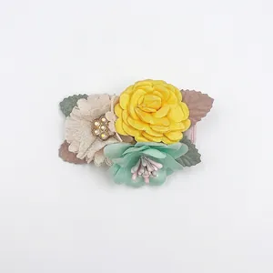 Artificial flower hair clips with colorful fabric roses and decorative leaf accents