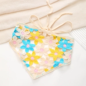 Close-up of floral crochet knit triangle headscarf with handmade pastoral flower patterns