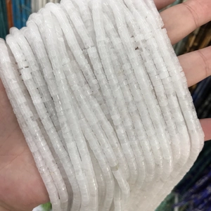 Close-up of 2x4mm white translucent rectangle spacer beads for DIY jewelry making