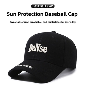 Close-up of white DeNse 3D embroidery on a black structured canvas baseball cap