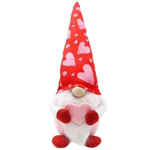 Handcrafted Mother's Day plush gnome with heart hat and long white beard on white background