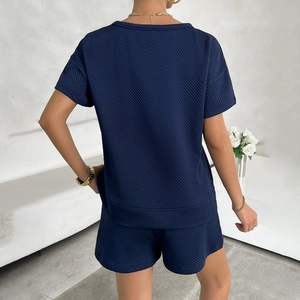 Women's summer navy knit two-piece set with textured t-shirt and shorts, back view