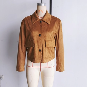 Detail of a brown faux suede jacket featuring large lapels and black button closure