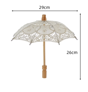 Detailed embroidery floral pattern on white lace wedding umbrella with wood handle