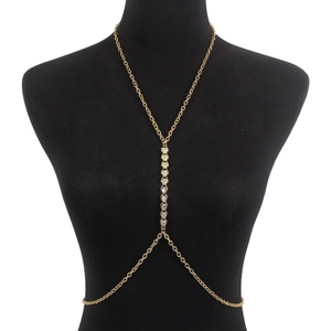 Sexy gold body chain with heart rhinestone accents shown on a black female mannequin