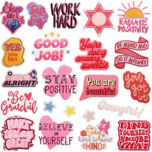 Various motivational quote embroidered patches in colorful heart and speech bubble shapes