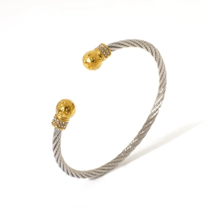 Two-tone stainless steel cable bangle with gold frosted beads and sparkling crystals