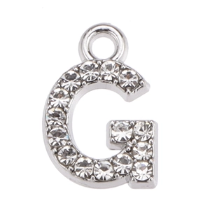 Detailed view of silver letter G pendant with white rhinestones and a hanging loop