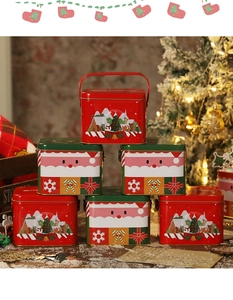 Scatole regalo in latta natalizie con motivi di Babbo Natale e villaggi invernali