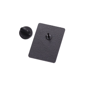 Macro view of the matte black metal pin back with a durable rubber clutch fastener