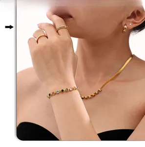 Close-up of 18k gold plated necklace and bracelet set with colorful round zircon stones