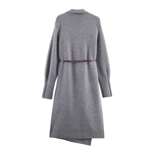 Detail of dark grey knit dress featuring brown belt and asymmetric hemline