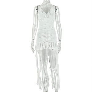 Detail of white halter neck dress featuring ruffled V-neck and layered fringe hemline