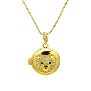 Close-up of a gold round bear pendant necklace with sparkling micro-inlaid zircons