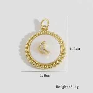 Macro detail of gold round moon pendant with dimensions 2.4cm by 1.8cm and 3.4g weight