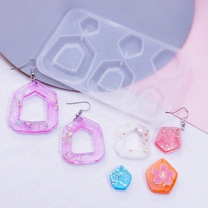 DIY silicone molds for geometric earrings showing stars moon and cat claw resin pendants