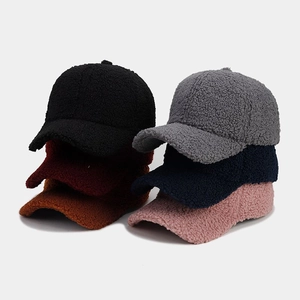 Close-up of thick lamb wool baseball caps showing six available colors and soft texture